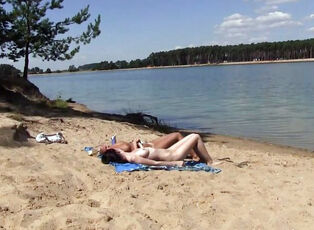 2 torrid russian nubile getting a suntan on the free beach.