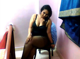 Indian Lil bra-less and in pantyhose demonstrate